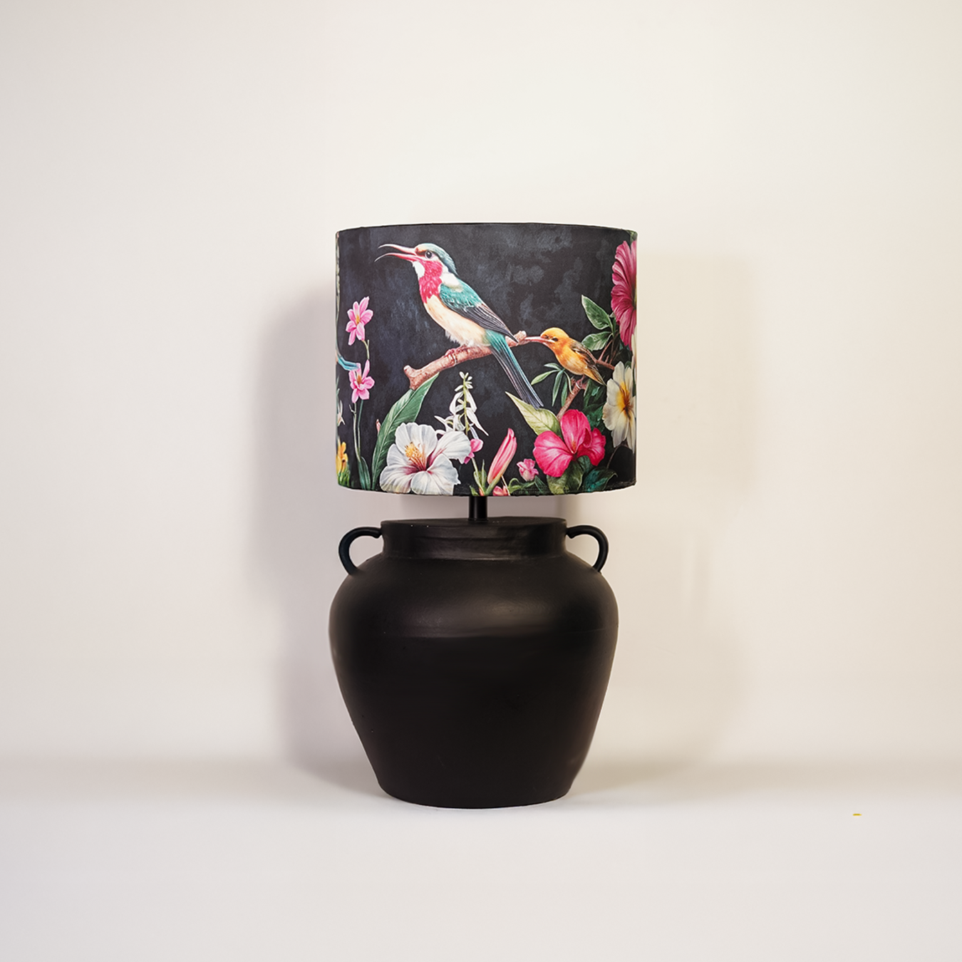 Chandani Bagh- Elegant black ceramic lamp adorned with delicate floral detailing.