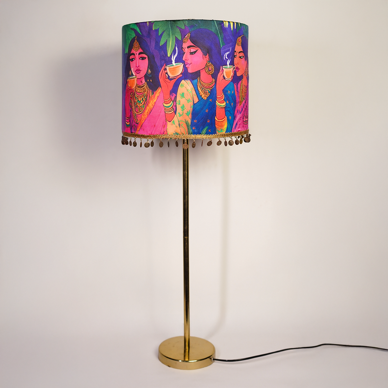 Gulaabi Sip - Sleek metal stand lamp crowned with a quirky pink pop Indian lampshade.