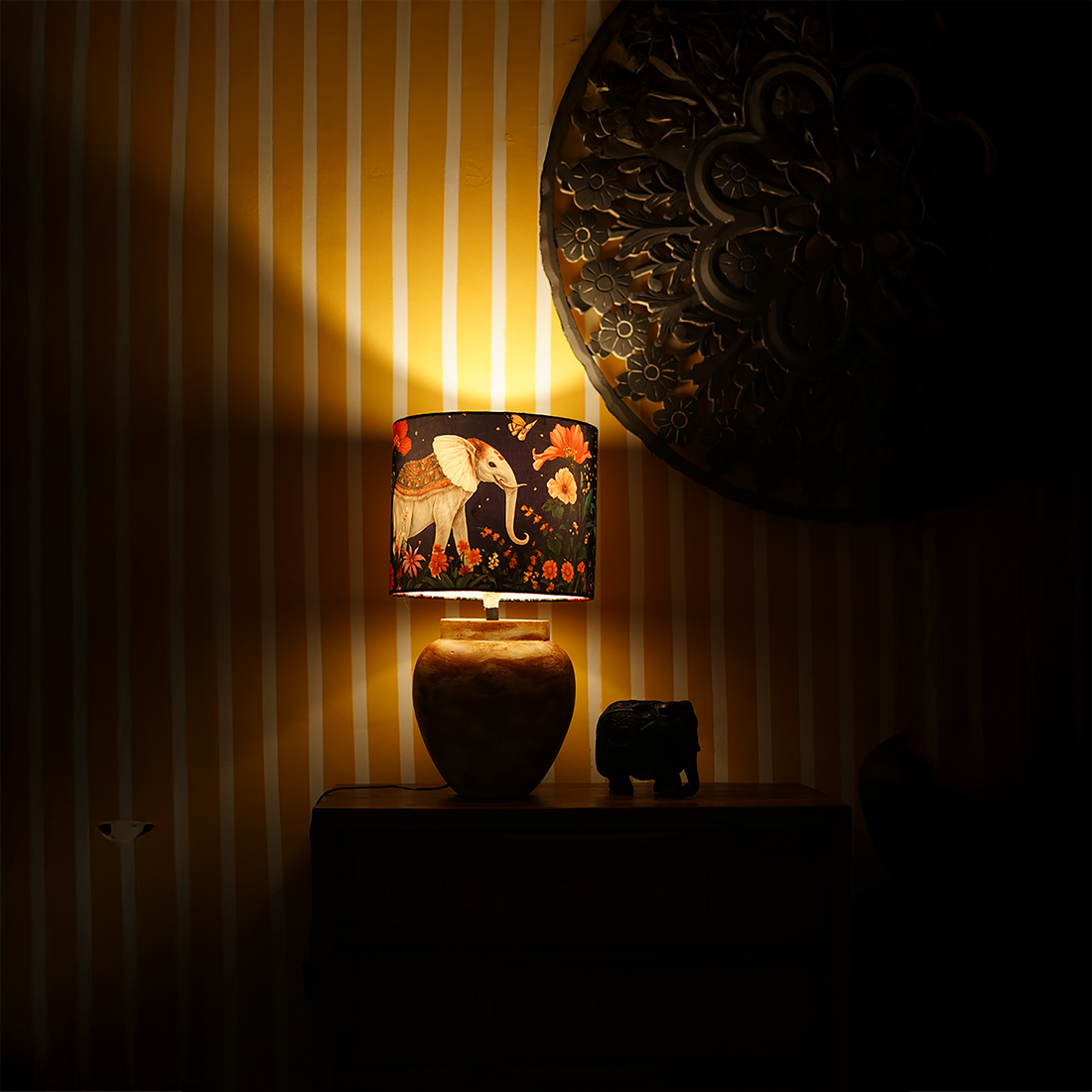 Shaahi Savaari -Mustard abstract ceramic lamp topped with a Mughal-inspired blue lampshade.