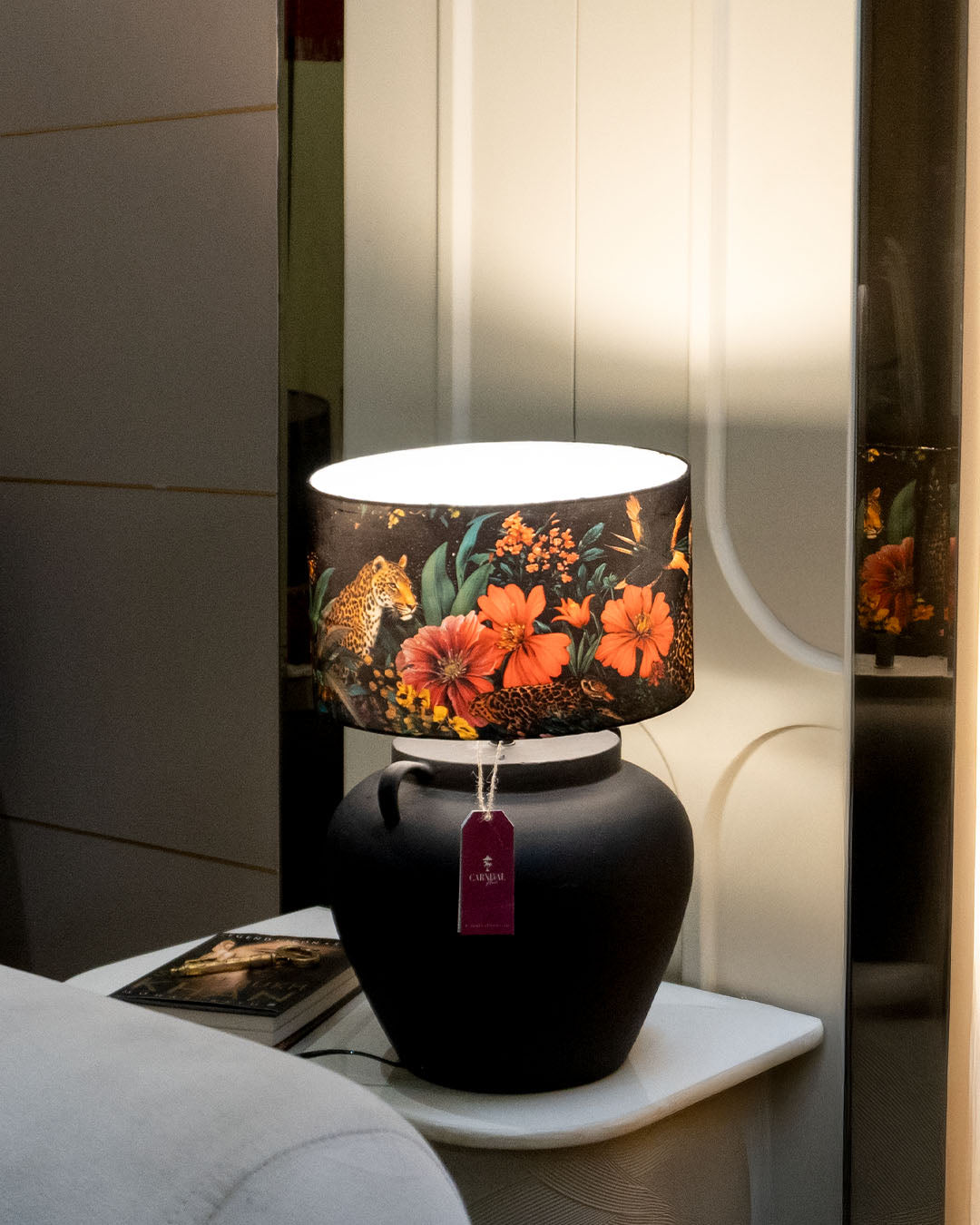 Bagh-e-Bahara - Charcoal black ceramic lamp paired with a vibrant black floral Indian lampshade.