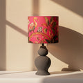 Gulaabi Baagh- Charcoal ceramic lamp paired with a vibrant pink floral Indian lampshade.