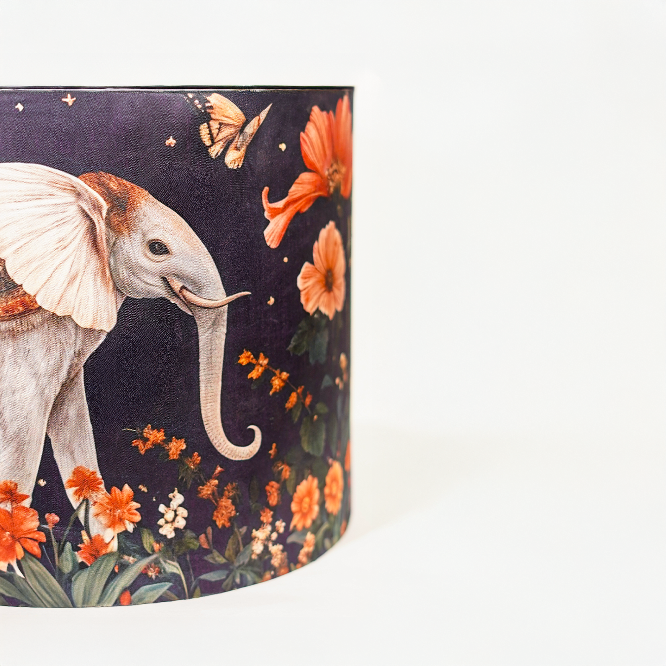 Shaahi Savaari -Mustard abstract ceramic lamp topped with a Mughal-inspired blue lampshade.