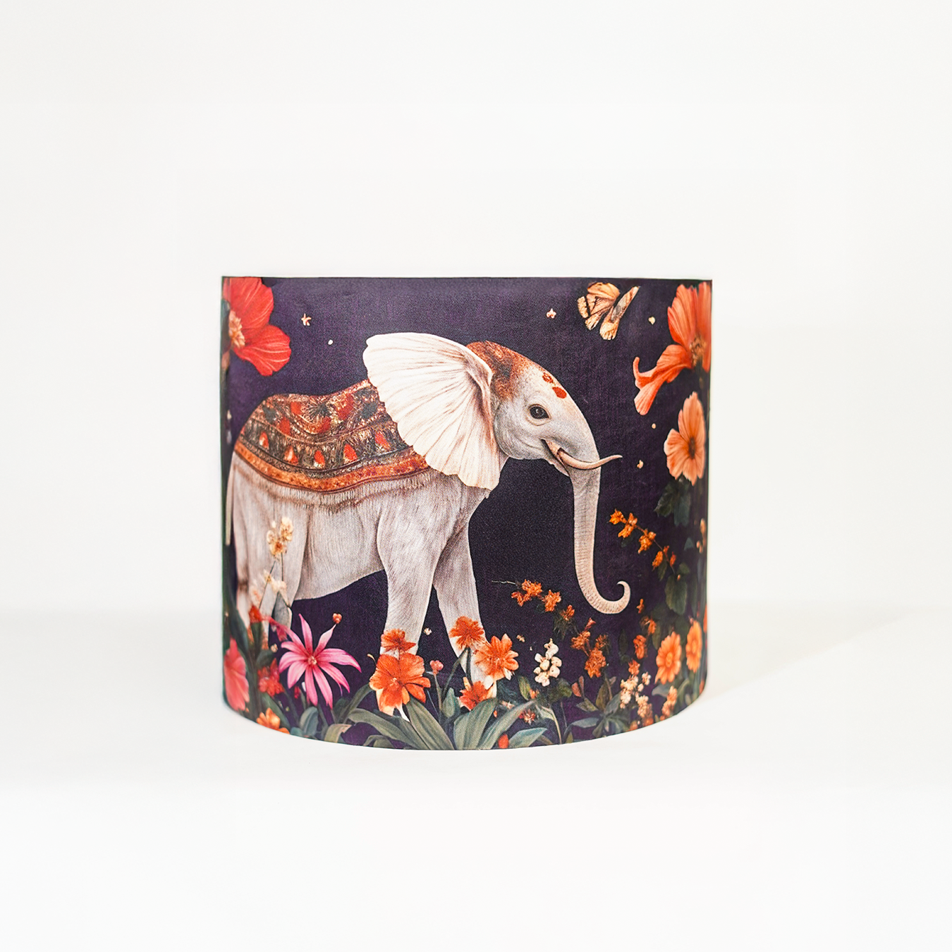 Shaahi Savaari -Mustard abstract ceramic lamp topped with a Mughal-inspired blue lampshade.